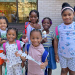 Children at a backpack giveaway at Second Farms in The Bronx.