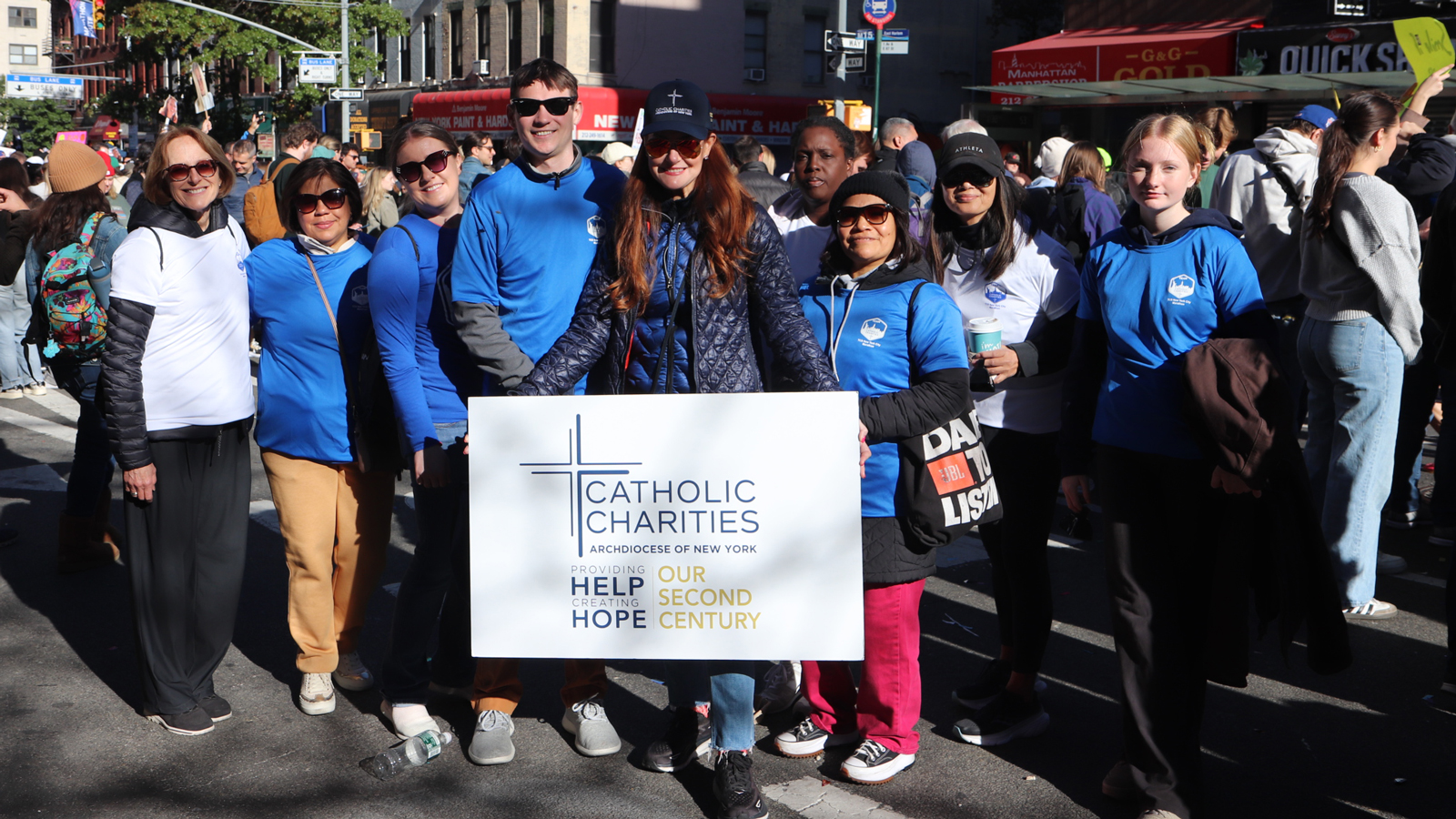 Team Catholic Charities' cheer section the New York City Marathon.