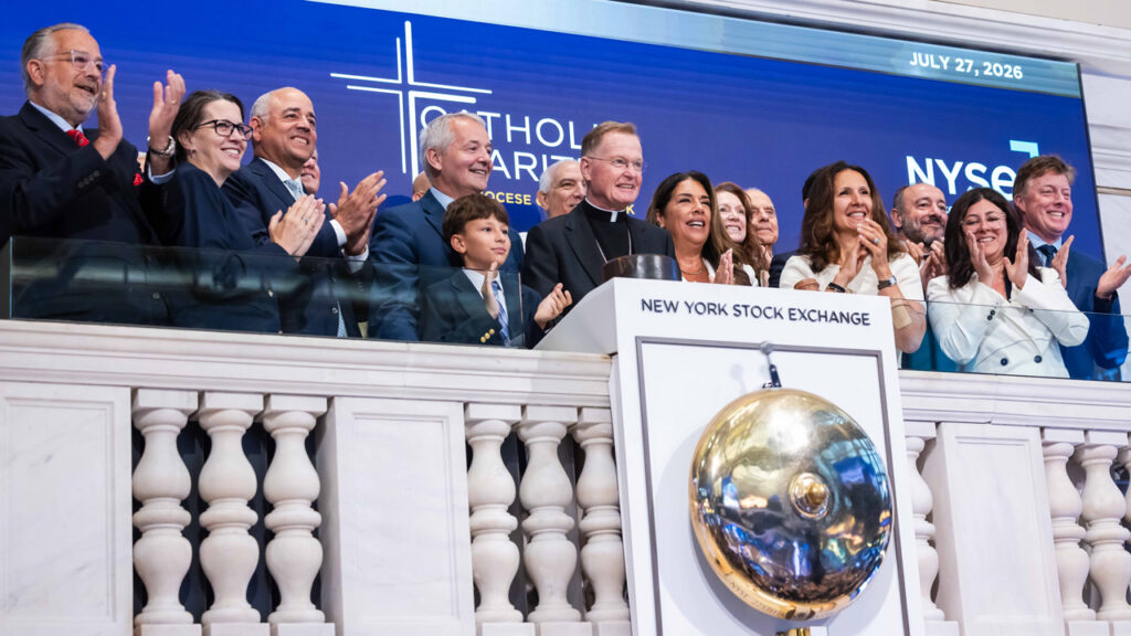 Business leaders ring bell at the New York Stock Exchange to advance Catholic Charities' mission.