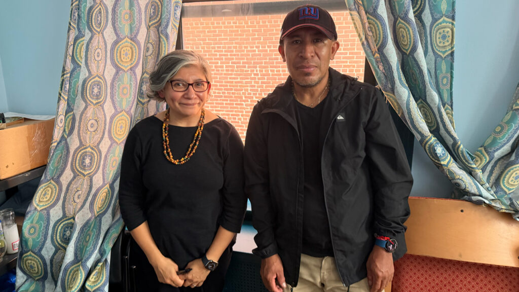 Catholic Charities case manager with client at St. Cecilia Parish's in East Harlem.