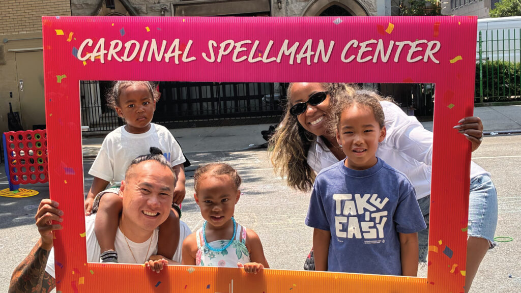 A family at the Cardinal Spellman Center Community Day in June 2026.